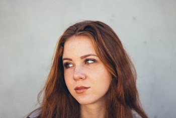 Woman Near Gray Wall