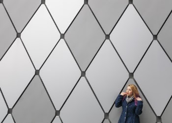 Woman Near Grey Wall