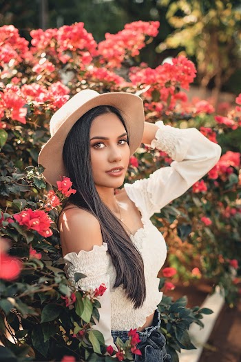 Woman Near Pink Petaled Flower Plants