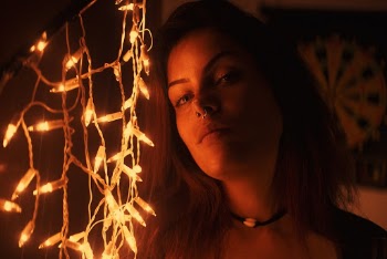 Woman Near String Lights