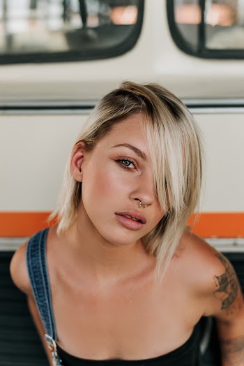 Woman Near White Bus