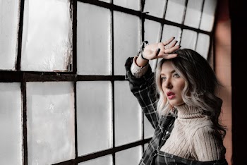 Woman Near Window