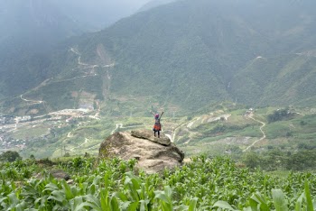 Woman on a Boulder in the Middle of a Farm