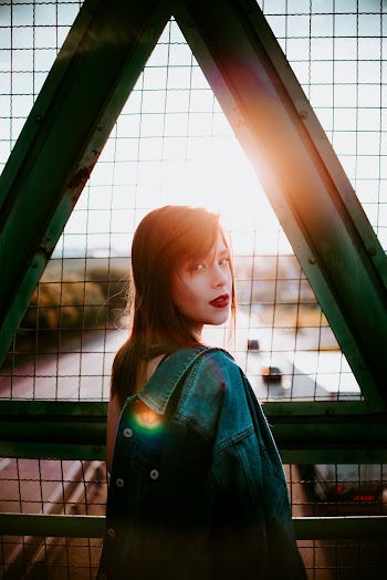 Woman On A Footbridge