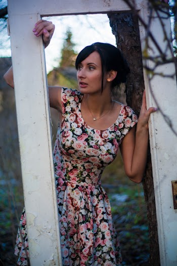 Woman on Door Beside Tree