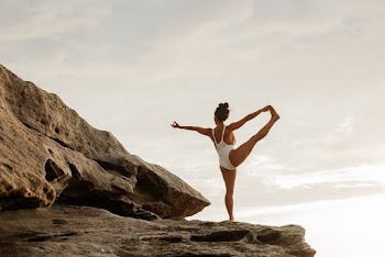 Woman on Rock in White Bikini