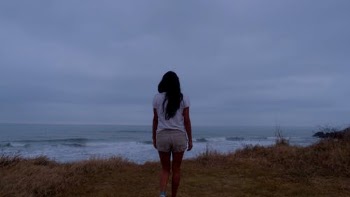 Woman on Sea Shore during Overcast · Free Stock Video