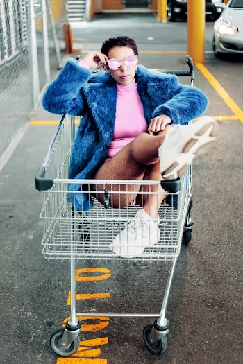 Woman On Shopping Cart