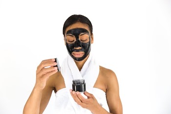Woman Opening Cosmetic Jar