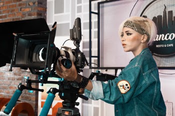 Woman Operating Video Recorder