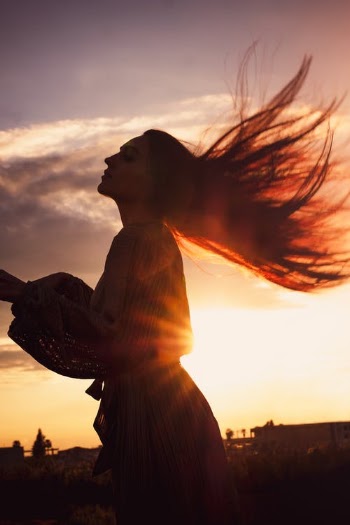 Woman Over Sunset Throwing Long Hair  · Free Stock Photo