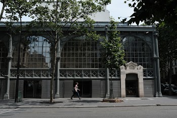 Woman Passing By A Building