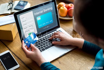 Woman paying online via a credit card
