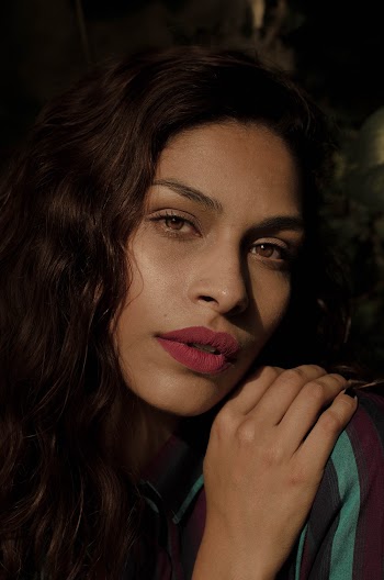 Woman Placing Her Right Hand on Her Cheek