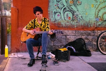 Woman Playing Acoustic Guitar