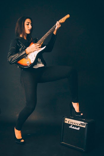Woman Playing Electric Guitar