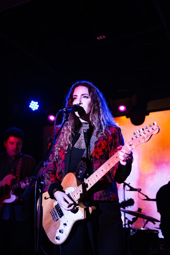 Woman Playing Electric Guitar