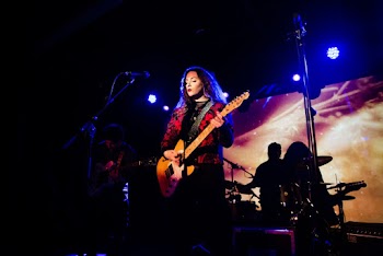 Woman Playing Electric Guitar