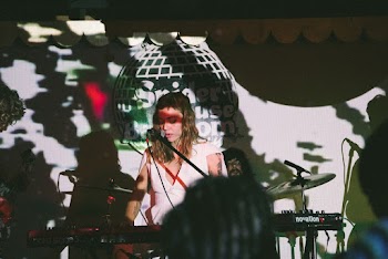 Woman Playing Electronic Keyboard While Singing