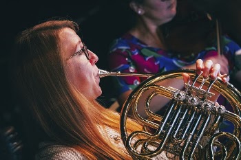 Woman playing French horn, October | Free Photo - rawpixel