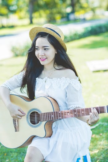 Woman Playing Guitar