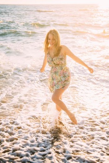 woman playing on sea waves in beach