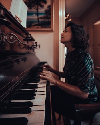 Woman Playing Piano Photograph