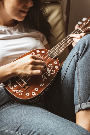 Woman Playing String Instrument