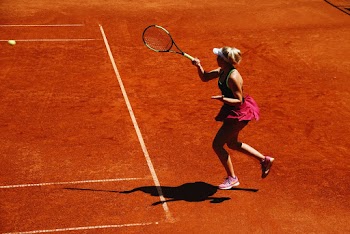 Woman Playing Tennis on Court
