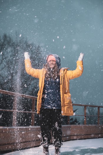 Woman Playing with Snow