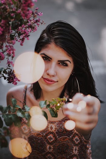 Woman Pointing Straight Ahead