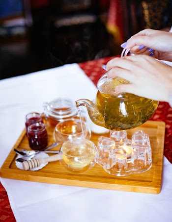 Woman Poring Tea