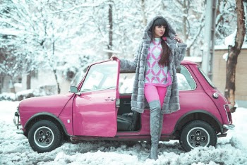 Woman Posing Beside A Pink Car