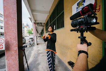 Woman Posing in Front of Dslr Camera