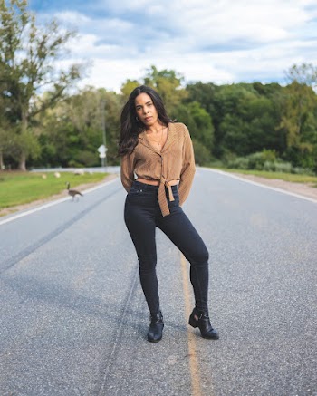 Woman Posing in the Middle of the Road