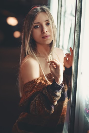 Woman Posing Near Glass Window