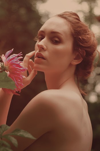 Woman Posing Near Pink Flower