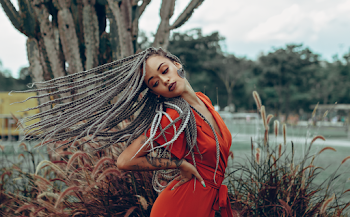Woman Posing Near Plants