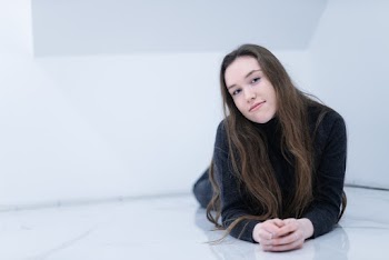 Woman Prawning on White Surface