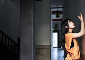 Woman Put Her Right Arm Close to the Wall