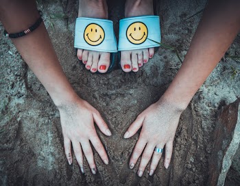 Woman Putting Hands On Soil