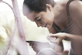 Woman Putting Lip Gloss