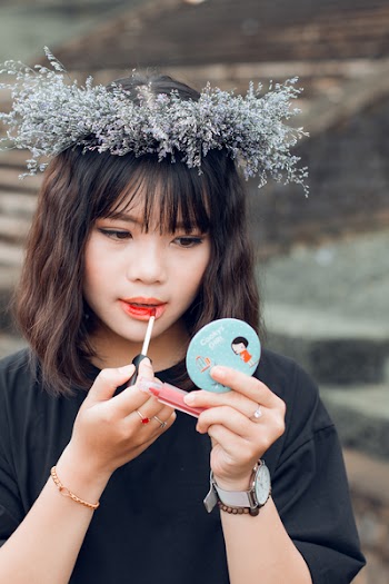 Woman Putting Lip Tint on Her Lips