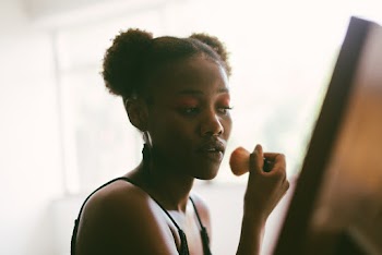 Woman Putting On Makeup