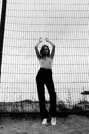 Woman Raising Both Arms
