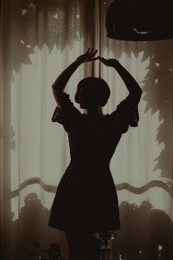 Woman Raising Both Hands