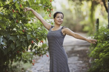 Woman Raising Both Hands Sideward
