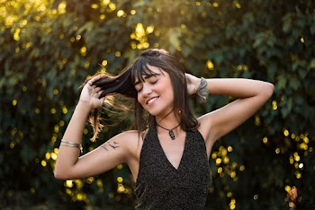 Woman Raising Her Both Arms