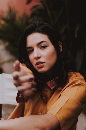 Woman Raising Her Right Hand