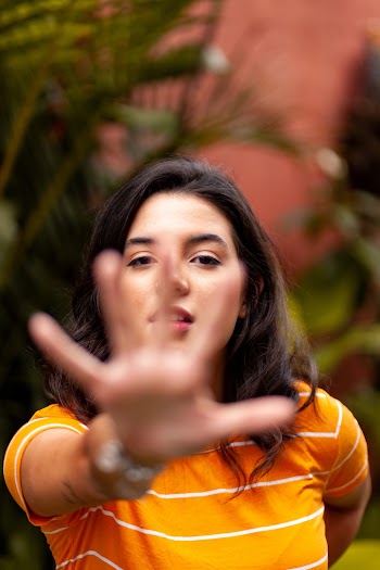 Woman Raising Right Hand